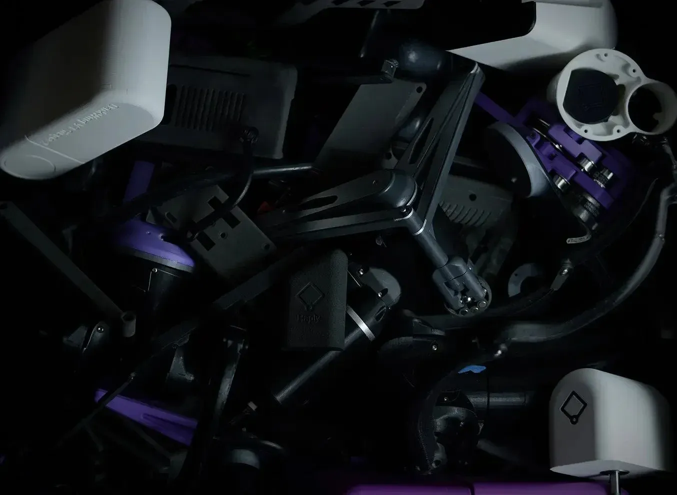 A box of 3D-printed design iterations at Haply Robotics