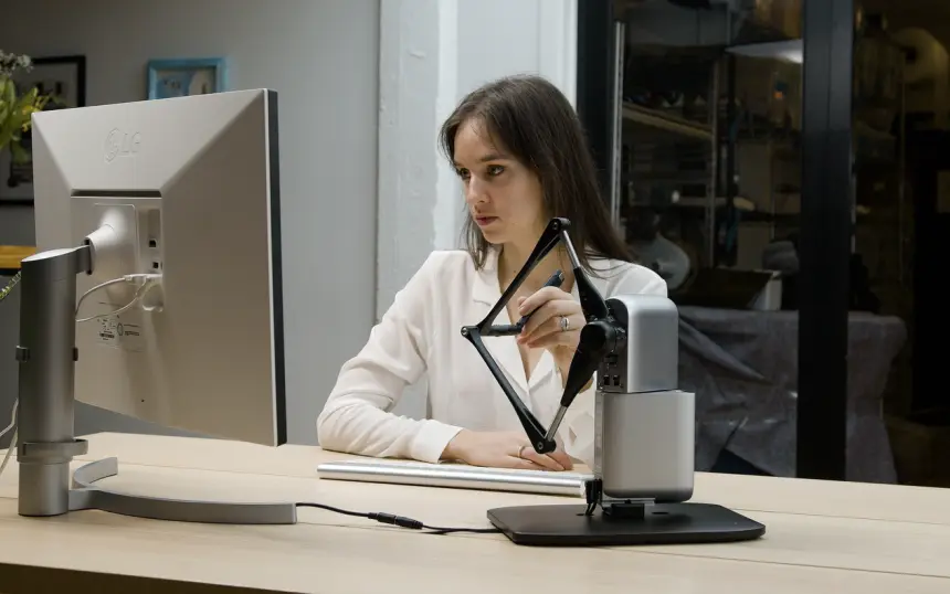 Inverse3 on a research desk beside lab equipment